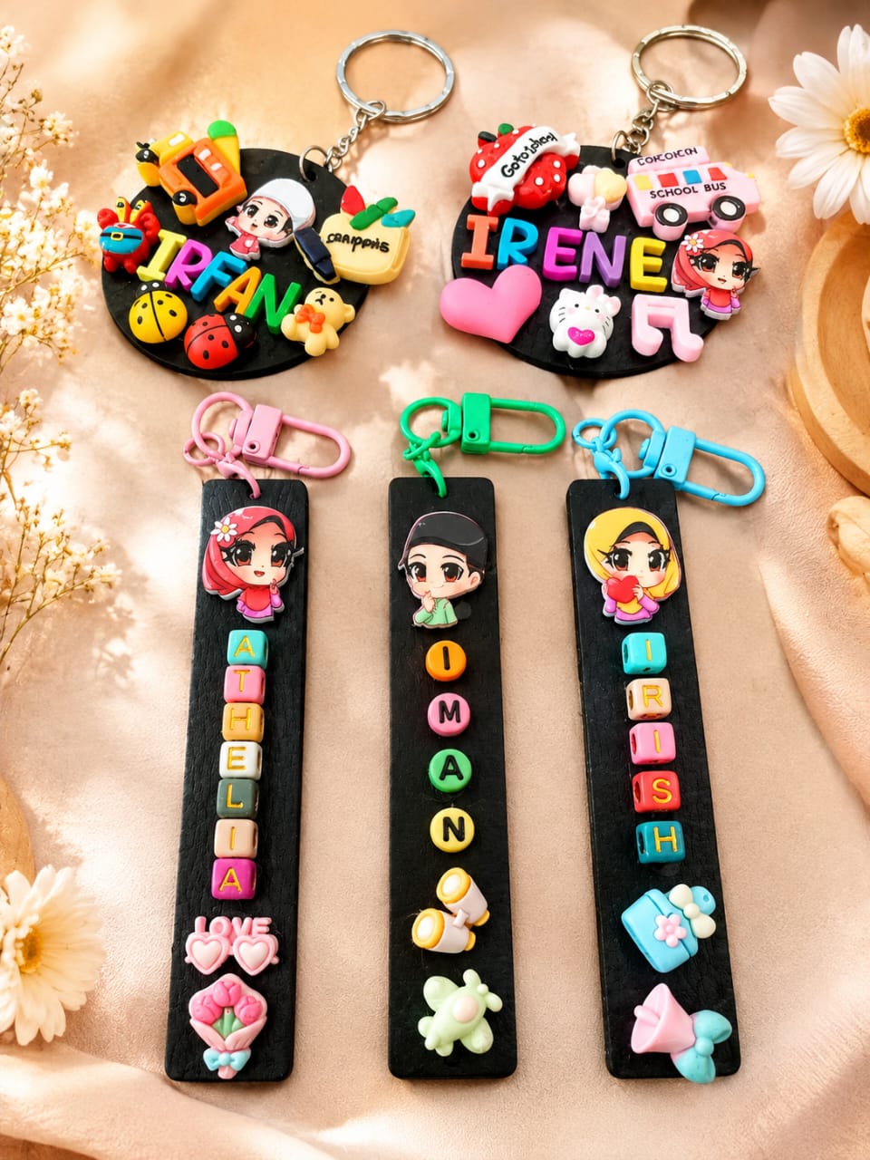 Name keychains and bookmarks spelled out in alphabet beads, made at a session